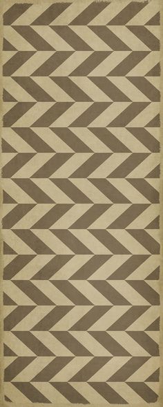 a brown and white rug with an abstract design