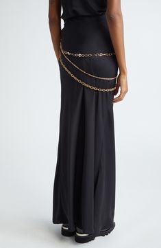 This fluid and flowy dress is topped with golden chains that drape over one shoulder. 42" length (size 40 FR) One-shoulder chain strap 100% polyester Hand wash, line dry Imported Designer Clothing Chic Evening Chain Strap Belt, Gold Chain Strap Dress For Evening, Chic Chain Belt For Evening, Gold Evening Dress With Chain Strap, Gold Chain Strap Evening Dress, Chic Evening Chain Belt With Chain Strap, Elegant Gold Dress With Chain Strap, Gold Dresses With Chain Strap For Evening, Luxury Chain Link Belt For Party