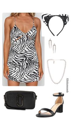 a woman in a zebra print dress and accessories