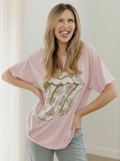 Our 100% Preshrunk Cotton thrifted tees are meaningfully distressed and officially licensed. Each piece is one of a kind, and colors/distressing may vary from shirt to shirt. Pairs well with vintage denim and your favorite kicks.The details:- 100% Preshrunk Cotton- Unisex Fit- Meaningfully Distressed, each piece unique- Colors + Distressing may vary- Officially Licensed Spring Distressed Graphic Tee T-shirt, Pink Graphic Print T-shirt For Loungewear, Acid Wash Band Merch T-shirt In Relaxed Fit, Casual Distressed Fan Merchandise T-shirt, Casual Pink T-shirt For Fan Merchandise, Pre-shrunk Graphic Tee For Fan Merchandise, Summer Distressed T-shirt For Fan Merchandise, Casual Fan Merchandise T-shirt For Spring, Distressed Crew Neck T-shirt For Loungewear