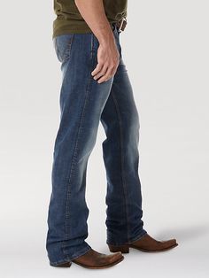 OUR WESTERN ROOTS MADE MODERN Wrangler® Retro® slim fit jeans nod to our history while introducing fits and washes suited for the modern cowboy. Designed with a closer fit and leg opening that still falls comfortably over boots, our men's Wrangler® straight leg slim fit jeans add extra style to the classic look you love. These jeans sit low on the waist and make it easy to show off your favorite belt buckle. That design detail is our Western heritage showing through, something that happens often Fitted Straight Leg Jeans For Ranch, Western Style Dark Wash Straight Leg Bottoms, Straight Leg Denim Jeans For Ranch, Rugged Fitted Straight Leg Bottoms, Fitted Dark Wash Jeans For Ranch, Fitted Jeans With Five Pockets For Ranch, Fitted Straight Leg Jeans For Rodeo, Western Style Dark Wash Jeans For Ranch, Dark Wash Jeans With Five Pockets For Ranch