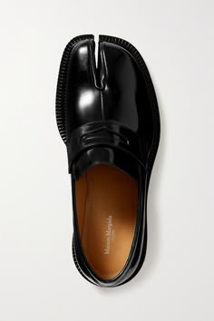 Find MAISON MARGIELA Tabi Split-toe Glossed-leather Loafers on Editorialist. Maison Margiela's distinctive 'Tabi' design is inspired by traditional split-toe socks - a style which originated in 15th-century Japan - and reimagined here as loafers. This pair has been made in Italy from glossed-leather with penny slots and chunky soles. Keep the uppers shiny by buffing them occasionally with a soft cloth. Shoe Rotation, Black Loafers Men, Maison Margiela Tabi, Dr Shoes, Tabi Shoes, Margiela Tabi, Margiela Shoes, Funky Shoes, Hype Shoes