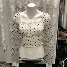 Turn Heads In This Sexy Blouse Crop Top And See Through Puffy Sleeves Pair With High Waisted Black Jeans Or Fox Leather Spanx For A Classy Sophisticated Look Polka Dot Long Sleeve Tops For Party, Polka Dot Long Sleeve Party Tops, Elegant Polka Dot Party Tops, Polka Dot Long Sleeve Top For Night Out, Chic Long Sleeve Tops With Swiss Dot, Long Sleeve Polka Dot Top For Night Out, Chic Polka Dot Swiss Dot Tops, Chic Swiss Dot Long Sleeve Tops, Trendy Polka Dot Blouse For Party