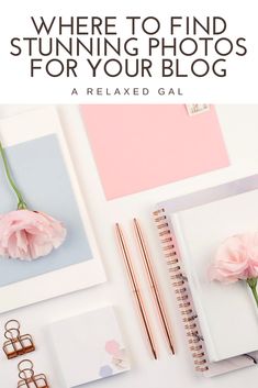 a desk with pink flowers, notebooks and pen on it that says where to find stunning photos for your blog