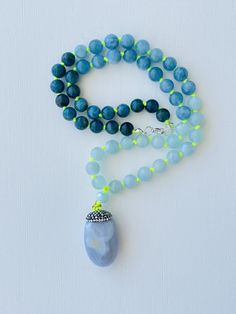 I love to use my voice and express myself. I speak my truth freely. I am honest about who I am. My throat chakra is balanced. This purchase includes: Gemstone Mala, baggie, card including using your mala, intention setting and properties. GEMSTONES Apatite: The stone is worn as a reminder for courage and confidence in pursuing one's goals. The stone has many layers of depth, with stunning shades of blue and grey. It is meant to inspire the wearer to live their truth. It is powerful for those on Holistic Jewelry With 108 Beads For Gift, Spiritual Round Pendant With Gemstone Beads, Spiritual Jewelry With Round Gemstone Pendant, Round Agate Jewelry For Meditation, Meditation Amulet Long Necklace, Spiritual Round Pendant Necklace For Meditation, Meditation Amulet Style Long Necklace, Amulet Style Long Necklace For Meditation, Holistic 108 Beads Jewelry For Meditation