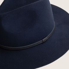 The Anderson hat is a floppy, wide brim fedora, made from super soft Australian wool, making it packable and ideal for travelling. The hat is available in navy and is trimmed with natural black leather. Elegant Wide Brim Felt Hat For Travel, Elegant Curved Brim Felt Hat For Travel, Elegant Felt Hat For Travel In Fall, Elegant Felt Hat With Curved Brim For Travel, Elegant Felt Hat For Fall Travel, Travel Fedora With Wide Brim In Fur Felt, Chic Leather Hat With Curved Brim, Navy Travel Hat With Curved Brim, Fall Travel Fedora With Curved Brim