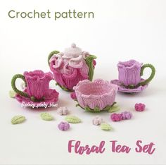 crocheted teapots, cups and saucers with leaves scattered around them