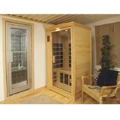 a room with a chair and a sauna in it