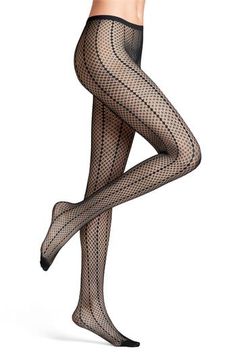 Vertical patterning defines these elegant tights made using a seamless technology that provides all-day comfort. Recycled polyamide/elastane   Machine wash, dry flat   Made in Italy High Stretch Fishnet Tights, Fitted Fishnet Nylon Tights, Black Tight Mesh Hosiery, Elegant Micro-elastic Elastane Hosiery, Black Stretch Elastane Hosiery, Fitted Fishnet Legwear In Nylon, Black High Stretch Mesh Hosiery, Fitted Nylon Fishnet Legwear, Fitted Fishnet Nylon Legwear