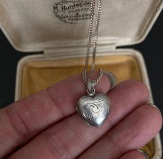 70s VINTAGE SILVER Locket and 16 inch Chain, Sterling Silver Engraved Pendant Necklace, Vintage Silver Jewelry, Heart Vintage Locket offered by Isobel Vintage Jewels on Etsy Style: Vintage 1970s real silver locket. A lovely heart shaped 70s side opening sterling silver locket big enough for putting little photos inside. You can add engraving to it as there is a space on the front for a name to be engraved! Colour: silver  Size: 2 x 2 cm and 16 inch chain Condition: Excellent condition Approximat Retro Heart-shaped Necklace For Gift, Retro Heart-shaped Necklace Gift, Retro Heart-shaped Jewelry Gift, Vintage Sterling Silver Necklaces For Valentine's Day, Vintage Sterling Silver Heart Necklace For Wedding, Vintage Sterling Silver Jewelry For Valentine's Day, Vintage Heart Necklace With Vintage Charm, Vintage Hallmarked Jewelry For Valentine's Day, Vintage Silver Heart Necklace For Wedding