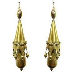 Add a touch of vintage elegance with these stunning 14k Victorian Drop Earrings. Crafted in 14k yellow gold and featuring a 2.25 inch length, these earrings have a delicate and feminine look. In good condition with minor wear, they make a perfect addition to any jewelry collection. 14k Victorian Drop Earrings Condition: In good condition with some minor surface wear consistent with age. Period: Victorian Length: 2.25 inches Markings: Metal: 14k Yellow Gold Weight: 5.9 grams Antique Yellow Gold Ceremonial Earrings, Antique Yellow Gold Drop Earrings, Vintage Drop Earrings For Ceremonial Occasion, Victorian Yellow Gold Drop Earrings, Vintage Ceremonial Drop Earrings, Classic Yellow Gold Chandelier Earrings, Victorian Style Hallmarked Earrings For Formal Occasions, Victorian Style Ceremonial Earrings For Pierced Ears, Victorian Style Ceremonial Dangle Earrings