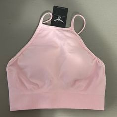 High Neck, Baby Pink Sports Bra Never Worn, Tags Still On! Solid T-back Sports Bra For Summer, Solid Color T-back Sports Bra For Summer, Spring Crop Top With Built-in Bra For Gym, T-back Sports Bra For Summer, Spring Sports Crop Top With Built-in Bra, Pink Stretch Crop Top For Training, Summer T-back Crop Top For Sports, Spring Sports Fitted Crop Top, Fitted Crop Top For Sports In Spring