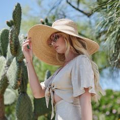 A true gem of a find! This Raffia style hat keeps you cool and out of the sun. Makes for a great go to when you head over to the beach or while reading by the pool. With an added touch of a faux suede band, this hat will be one of your favorites. Features: 6" Brim UPF 50+ Adjustable 100% Raffia Women's one size Faux Suede Band Raffia Braid Wide Brim Summer Fedora Panama Hat Made Of Palm Leaf, Summer Brimmed Sun Hat Made Of Palm Leaf, Adjustable Short Brim Straw Hat For Sunbathing, Short Brim Straw Hat For Sunbathing Vacation, Wide Brim Sun Hat With Uv Protection For Summer, Summer Wide Brim Sun Hat With Uv Protection, Brimmed Sun Hat With Uv Protection For Sunbathing, Vacation Straw Hat With Short Brim For Sunbathing, Summer Sun Hat With Uv Protection And Wide Brim