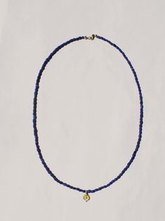 A tiny amulet with a re-imagined ancient charm strung on lapis beads. 22k gold charm on lapis beaded necklace, measures 18” long. Takara Design is a women-owned, small business based in Oregon. Blue Lapis Lazuli Amulet Jewelry, Lapis Lazuli Amulet For Meditation, Lapis Jewelry, Lapis Necklace, Horse Necklace, Jewelry Accessories Ideas, Wild Horse, Jewellery Store, Silk Cord