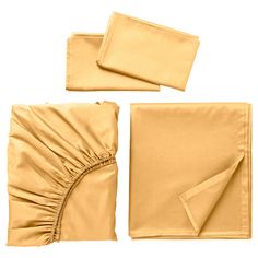 four pieces of plain gold cloth folded on top of each other