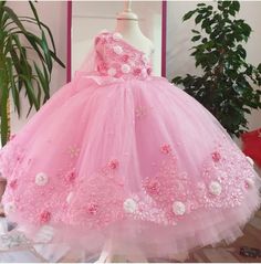 This dress will be the perfect choice for your little one's special day, whether it be a birthday, christening or first holy communion. The beautiful color dress is contrasted with detail and complimented by a bridal look. - - and completely lined in the softest silk chiffon, this is a truly luxurious and elegant pink dress. If your baby girl loves pink then why not make her feel extra special on her special day? This beautiful dress is made with much love for your lovely kid. It is perfect for special occasions, birthday parties, photo shooting for babies, cake smash photo shooting, and any kind of formal event. Made here in the USA!! As a mother, buyer comfort for our kids is most important. Looking fancy and at same time comfortable is the match I am trying to apply to my designs. The d Pink Dress Toddler, Puffy Pink Dress, Pink Flowers Birthday, Dress Sweet 16, Toddler Pageant, Gown Pink, Pageant Gown, Flowers Birthday, Princess Gown