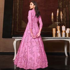 This pink colored anarkali suit is beautifully adorned with zari embroidered and sequins work as shown. This net anarkali suit comes along with semi stitched satin bottom, lining and net dupatta which makes it appear more adorning. Women can buy this suit to wear for their party, sangeet, homely events and ideal for any fashionista. Note:- The actual product may differ slightly in color and design from the one illustrated in the images when compared with computer or mobile screen. Size Chart Size: Semi Stitched/Unstitched can be altered from maximum to minimum size based on size chart Pink Churidar With Dabka Work For Reception, Pink Dabka Work Churidar For Reception, Elegant Pink Churidar For Reception, Pink Anarkali Set For Reception, Pink Anarkali Set With Zari Work, Pink Anarkali Set For Eid, Pink Long Sleeve Anarkali Set For Reception, Pink Zari Work Churidar For Reception, Reception Pink Churidar With Zari Work