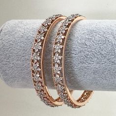 Set of 2 Rose Gold American Diamond Bangles(2PCS)/Bracelet/Indian Party Wear Bangles/CZ stone bangles/Indian wedding/bridal jewelry Ships from California in 1 business day Delivery in 2-5 business days in the USA Rose Gold Wedding Bangle With Diamond Accents, Rose Gold Round Bracelets For Festive Occasion, Rose Gold Round Bracelet For Festive Occasion, Rose Gold Hand Set Bangle For Anniversary, Sparkling Rose Gold Bangle Jewelry, Dazzling Rose Gold Wedding Bracelets, Sparkling Rose Gold Bangle, Festive Rose Gold Bangle Jewelry, Rose Gold American Diamond Jewelry For Wedding