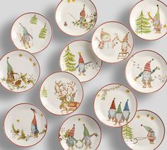 twelve plates with christmas designs on them