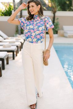 We can't let you go before you take a look at this blouse! This floral blouse is just so cute and feminine! It's also versatile! You can wear it to dinner or work, summer or spring! The options are endless! High round neckline Short bubble sleeves Tied back detail Floral print No stretch Savannah is wearing the small. Summer Short Sleeve Blouse For Garden Party, Short Sleeve Blouse For Summer Garden Party, Chic Floral Print Blouse For Garden Party, Feminine Spring Blouse For Garden Party, Feminine Blouse For Spring Garden Party, Feminine Blouse For Garden Party In Spring, Spring Cotton Blouse With Floral Print, Spring Garden Party Blouse With Floral Print, Floral Print Blouse For Spring Garden Party