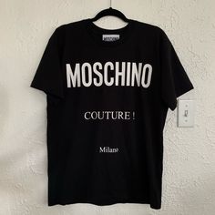 Moschino Couture Oversized Tee Black And White Size Xs It This Has An Oversized Fit And It’s Recommended To Size Down. I Usually Wear Smalls And Included A Styling Photo To Show How It Fits. Worn 2x And In Like New Condition Purchased From Farfetch And Shipped From Eleonora Bonnucci In Italy Included Photo Of The Invoice (Personal Info Edited Out) Black Designer Logo Crew Neck Top, Black Crew Neck Top With Designer Logo, Black Crew Neck Tops With Designer Logo, Casual Designer Logo Tops For Streetwear, Casual Tops With Designer Logo For Streetwear, Black Logo Tops For Spring, Black Designer Logo Top For Streetwear, Casual Black Top With Logo Lettering, Black Cotton Tops With Designer Logo