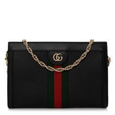 This is the authentic GUCCI Calfskin GG Web Small Ophidia Chain Shoulder Bag in Black. This chic shoulder bag is crafted of calfskin leather trim with a red and green web stripe down the middle. The bag features a polished gold chain shoulder strap and a gold GG logo on the front. The top opens to a partitioned beige microfiber interior with a patch pocket. Gucci Travel Bag With Chain Strap, Gucci Shoulder Bag With Chain Strap, Gucci Leather Clutch Shoulder Bag, Gucci Shoulder Bag With Chain Strap For Everyday Use, Gucci Ophidia Bag Outfit, Black Bag Outfit, Gucci Ophidia Bag, Green Web, Gucci Crossbody Bag