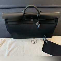 Authentic Hermes Herbag Zip Cabine 50 In Black Noir. Dimensions: L 19.7" X H 13.4" X D 8.9" Comes With Its Dust Bag And Zip Pouch As Shown. In Really Good Condition, Just A Few Light Scuffs Here And There But Overall Looks Great As Shown. Please Ask Any And All Questions, As Returns Are Not Accepted. Noir Color, The Close, Close Up Pictures, Leather Pieces, Hermes Bags, Zip Pouch, Duffel Bag, Black Noir, Bags Handbags