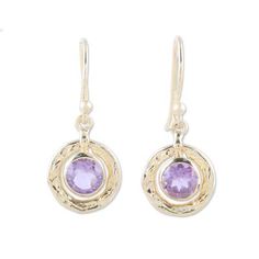 These eye-catching earrings from designer Neetu Barathi feature textured wreaths of 18k gold-plated sterling silver. Centering those wreaths are over one carat of faceted amethyst gems whose mysterious depths reveal flashing glints of brilliant color in the light. The bezel-set gemstones swing freely within the outer rings. Elegant Gold Amethyst Hoop Earrings, Elegant Hammered Round Earrings, Elegant Amethyst Dangle Hoop Earrings, Yellow Gold Drop Earrings With Birthstone, Yellow Gold Birthstone Drop Earrings, Elegant Purple Round Hoop Earrings, Gold Amethyst Round Earrings, Gold Amethyst Earrings Fine Jewelry, Gold Birthstone Round Earrings