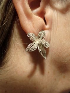 Maltese Filigree Flower Earrings. hand made in the 1970s. Clip ons. beuatiful Silver work. I have taken close ups so you can see the work. Easy to put on and the clips are still strong. Very pretty and unusual. They were bought as a gift for my Mum from my Dad, so I know their history but even though they are 1970s, they are still very pretty for today. They have the Silver mark on the clips. Please see the photos. Vintage Flower-shaped Pierced Earrings, Vintage Flower Shaped Earrings, Unique Flower-shaped Pierced Earrings, Handmade Flower Earrings For Formal Occasions, Formal Handmade Flower Earrings, Traditional Pierced Flower Jewelry, Vintage Handmade Silver Flower Earrings, Vintage Silver Handmade Flower Earrings, Vintage Silver Flower-shaped Earrings