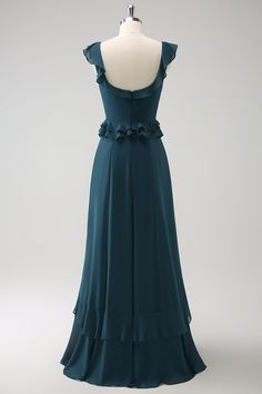 the back of a dress on a mannequin headdress, with an open neckline and ruffles