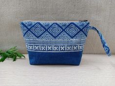 Boho Handmade Makeup Pouch Color: Blue and White Notes: The patterns on the pouch are not exactly the same due to the cut of the fabric. We will choose the pattern randomly for you, or if you want to select specifically, please send us a message !! Details: - The front and back of the pouch are made of cotton, dyed naturally into this indigo blue color. The tribal patterns are printed using block printing technique. - The size of the pouch makes it convenient for you to store makeups or small st Blue Portable Pouch Cosmetic Bag, Portable Blue Pouch Cosmetic Bag, Blue Rectangular Pouch For Daily Use, Rectangular Blue Pouch For Daily Use, Blue Rectangular Cosmetic Bag For Daily Use, Blue Pouch Cosmetic Bag For Daily Use, Blue Cosmetic Pouch Bag For Personal Use, Blue Zipper Pouch For Daily Use, Portable Blue Pencil Case Pouch