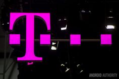 the logo for t - mobile is lit up at night