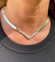 Adorned with 13 Marquis-Cut White Diamonds totaling approximately 2.50 Carats and set in 39 grams of 14K Yellow Gold, this is the rare showpiece you can only get at Pacific Jewelry. The diamonds are prong set and mounted in a gorgeous herringbone necklace that fits seamlessly on the neck. Details: ✔ Stone: Diamond ✔ Diamond Carat: 13 Diamonds, 2.50 Carats ✔ Diamond Cut: Marquis ✔ Diamond Color: G-H ✔ Diamond Clarity: VS2-Si1 ✔ Era: 1990's ✔ Length: 16 Inches ✔ Total Item Weight (Grams): 39.3 Gra Luxury 14k Stamped Diamond Necklace, Marquis Diamond, Serpentine Necklace, Diamond Chain Necklace, Neck Details, Herringbone Necklace, Marquise Cut Diamond, Square Earrings Studs, Diamond Chain