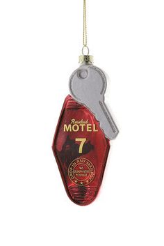 a red bottle shaped ornament with a key hanging from it