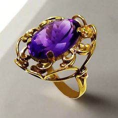 This exquisite ring is crafted from 14k gold and glistening with a deep purple amethyst. This timeless piece of jewelry will be a luxurious addition to your collection. Ring in Gold 14k Amethyst gemstone Elegant Purple Solitaire Birthstone Ring, Formal 14k Gold Amethyst Ring, Formal 14k Stamped Amethyst Ring, Formal Purple Birthstone Ring With Prong Setting, Elegant Amethyst Birthstone Ring For Formal Occasions, Classic Amethyst Purple Rings, Elegant Purple Sapphire Solitaire Ring, Formal Amethyst Birthstone Ring With Center Stone, Elegant Purple Solitaire Sapphire Ring