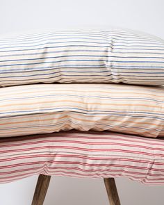 three pillows stacked on top of each other