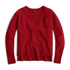 a red sweater with an open v - neck