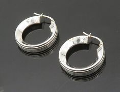 "925 Sterling Silver - Vintage Shiny Round Minimalist Drop Earrings - EG10275  925 Sterling Silver - Vintage Shiny Round Minimalist Drop Earrings - EG10275  Jewelry Type:         Earrings   Metal Type:            925 Silver  Metal Size:             1\"   Stone Type:            N/A  Condition:              N/A  Jewelry Weight:     2.6 Grams  PLEASE NOTE: THIS ITEM IS PRE-OWNED. ALTHOUGH MOST ITEMS ARE IN VERY GOOD CONDITION, SOME MAY NEED CLEANING AND/OR MINOR REPAIRS. WE MAKE A VERY STRONG EFFORT TO UPLOAD CLEAR PICTURES. PLEASE INSPECT ALL PICTURES AND ASK ALL QUESTIONS YOU MAY HAVE PRIOR TO MAKING A PURCHASE. NOT ALL STONES ARE GENUINE, SOME ARE ENHANCED OR CREATED." Contemporary Sterling Silver Hoop Jewelry, Silver Hallmarked Minimalist Earrings, Silver Minimalist Hallmarked Earrings, Elegant Hoop Earrings Stamped 925, Minimalist Hallmarked White Gold Earrings, Contemporary Round Earrings, Contemporary Round Earrings For Everyday, Contemporary Everyday Round Earrings, Elegant Formal Hoop Earrings Stamped 925