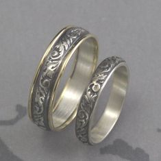 Bands His and Hers Ring Pattern Wedding Band Men's Wedding Rings Women's Comfort Fit Rings Gold Silver Ring Set Wedding Rings Two Tone Our two tone Going Baroque wedding band set is a lovely compliment to a garden style wedding. With this listing you can pair our Touch of Gold Going Baroque Band with its matching sterling silver mate. The all silver band is hand forged from 3.5mm silver preformed pattern wire that has been imprinted with a swirl and leaf design. Its two tone partner is made from Polished Wedding Ring Jewelry, Wedding Ring Jewelry With Polished Finish, Wedding Rings With Intricate Design, Heirloom Wedding Band Adjustable, Heirloom Style Polished Wedding Stackable Rings, White Gold Marriage Rings With Decorative Band, Adjustable Stackable Rings With Intricate Design For Wedding, Engraved White Gold Couple Rings For Wedding, Wedding Couple Rings In Sterling Silver, Hallmarked