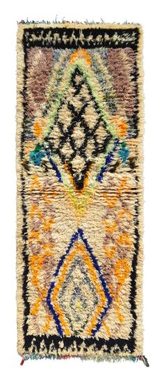 a multicolored rug with fringes on it