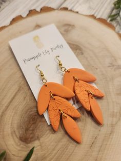 Summer Polyomer Clay earrings. Super fun orange dangle earrings. Perfect for a date night, concert outfit or just for fun. Lightweight, fun and trendy. Trendy Orange Earrings For Summer, Orange Dangle Earrings For Party, Trendy Handmade Orange Earrings, Party Orange Earrings With Ear Wire, Orange Party Earrings For Pierced Ears, Trendy Orange Drop Earrings, Trendy Orange Dangle Earrings, Casual Orange Earrings, Fun Orange Dangle Jewelry