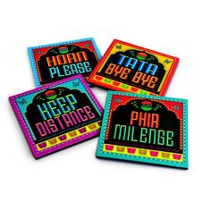 three coasters with the words happy birthday and mardi gras written on them