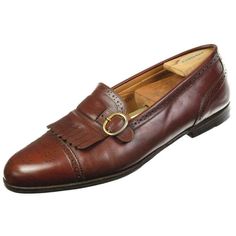 Rare SANTONI "Classico" old stock slip-on loafers. These are some of the most well-made shoes by Santoni. Size 10 D (US). Uppers are brown leather with decorative brogue and kiltie accents. Lined with calfskin. Made in ITALY. Excellent condition. Uppers are in great condition with some normal markings of wear (some scratches and darkening towards the tips and heels). Normal wear on interiors and outer soles. See photos for details. *Photos are of the actual item* Measurements: - Length of insole Vintage Leather Brogue Slip-on Shoes, Vintage Leather Slip-on Shoes With Brogue Detailing, Vintage Leather Monk Strap Shoes For Formal Occasions, Vintage Tassel Loafers With Leather Sole For Work, Vintage Brown Monk Strap Shoes For Formal, Vintage Loafers With Brogue Detailing For Work, Vintage Monk Strap Shoes With Round Toe For Business, Vintage Slip-on Oxfords With Leather Sole, Vintage Brogue Loafers For Work