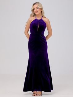 a woman in a long purple dress