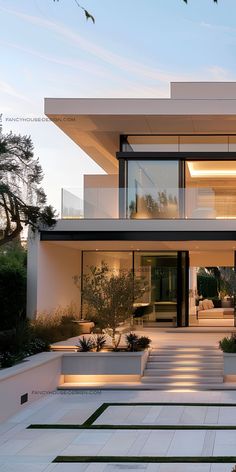 an exterior view of a modern house with stairs leading to the upper floor and second story