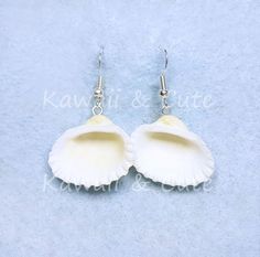 Marine Shells Earrings. Very light and comfortable to wear. We hope you like. Height 2 cm Width 2,5 cm White Shell Jewelry Gift, Kawaii White Jewelry For Gifts, Ocean-inspired Shell Earrings For Gifts, Ocean-inspired Shell Earrings As Gift, Ocean-inspired Shell-shaped Earrings For Gifts, Handmade White Kawaii Jewelry, White Handmade Kawaii Jewelry, White Round Earrings For Beach, Cute White Beach Jewelry