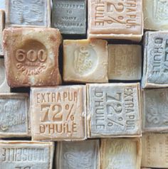 several different types of soaps are stacked on top of each other, with the price tag