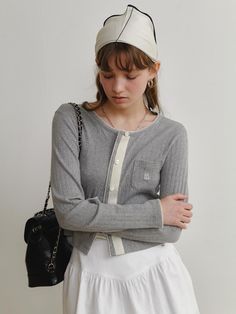 This product is the Morley Cardigan, which exudes a casual yet refined vibe with its textured knit and button-front design. It’s perfect for layering over a tee or a blouse, and features a relaxed fit that ensures comfort without sacrificing style. The cardigan includes a small patch pocket, adding a functional and quaint detail. - The textured knit of the Morley Cardigan adds a cozy and inviting touch to any look.- A button-front design allows for easy styling and versatility in wear.- The relaxed fit provides comfort, making it ideal for day-long wear or layering in cooler temperatures.- A small patch pocket not only adds charm but also a touch of practicality for carrying small essentials. Casual Textured Knit Everyday Cardigan, Casual Everyday Textured Knit Cardigan, Button-up Textured Knit Sweater For Layering, Textured Knit Button-up Cardigan For Layering, Layering Textured Knit Button-up Top, Gray Cardigan With Button Closure For Layering, Gray Textured Knit Cardigan For Layering, Gray Button-up Cardigan For Layering, Knit Tops With Buttons For Everyday Wear