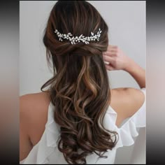 the back of a woman's head wearing a bridal hair comb