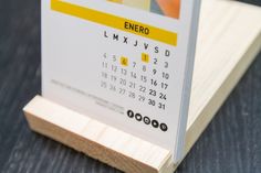 a wooden stand with a calendar on it